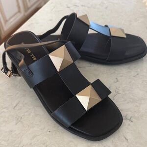Chic Black Sandals with Gold Accents